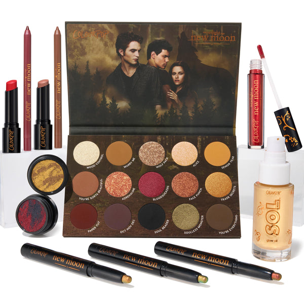 ColourPop Full Collection Set Twilight New Moon bundle showcases an open 15βpan eyeshadow palette with forest cover art, two Super Shock shadows, three shadow sticks, lip pencils, lippie stix, red gloss, and SOL glow oil on a white backdrop.