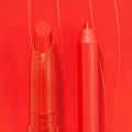 Sealed with a Kiss ColourPop Lippie Stix + Pencil Set shown side by side, creamy red Lippie Stix and matching precision lip pencil in vivid scarlet, set against a glossy red swatch background.