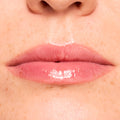 Glossy lips wearing Get Rich ColourPop Glossy Lip Balm Trio, showing a sheer berryβpink tint and high-shine, hydrated finish in a tight macro close-up of the mouth and surrounding skin.