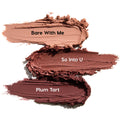 ColourPop Shadow Stix Burgundy Besties swatches show three creamy eyeshadow smears - Bare With Me (soft nude), So Into U (rosy mauve), and Plum Tart (deep burgundy) - streaked horizontally on a white background for shade comparison.