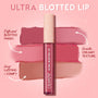 ColourPop Ultra Blotted Lip in Edgy Vibes stands upright with a cream cap and star accents, centered over three rosy mauve swatches that show a diffused blotted finish, smooth creamy texture, and long‑lasting comfy wear on a pink backdrop.