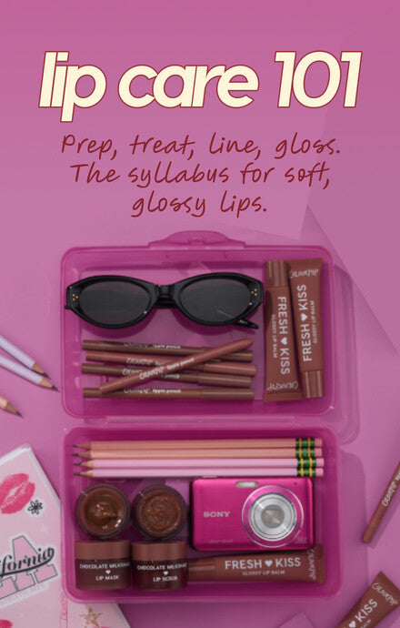 ColourPop Fresh Kiss lip care kit arranged in a pink school pencil case - lip liners, lip balm, gloss, and lip scrub - styled with black sunglasses and a pink Sony camera on a pink backdrop under “lip care 101” back-to-school headline.