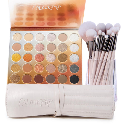 Metallic Mood ColourPop Shadow Palette & Brush Set showcasing a 30-pan warm-to-cool mix of matte and metallic neutrals - golds, coppers, silvers - with soft pink-handle brushes in a clear cup beside a cream ColourPop brush roll on a white background.