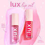 ColourPop Lux Lip Oil in Raspberry Mojito shown in two clear tubes with blush caps and star accents, set on pink swatches to demonstrate sheer glossy color and a comfy, non‑sticky finish - a hydrating lip oil tint ideal for everyday wear.