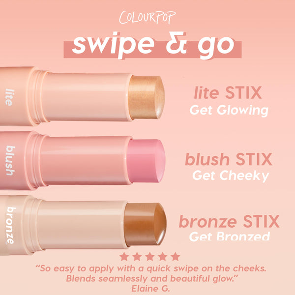 ColourPop Lite Stix in Sunlight shown uncapped and twisted up, a champagne-gold cream highlighter in a soft peach tube, ready to swipe on; displayed beside blush and bronze stix on a pink gradient background.