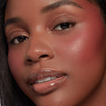 Neutral nude shimmer and matte shades from the Nude Mood ColourPop Shadow Palette blended on the eyelids, captured in a close-up with rosy cheeks and glossy lips, showcasing soft everyday tones and a smooth, luminous finish.