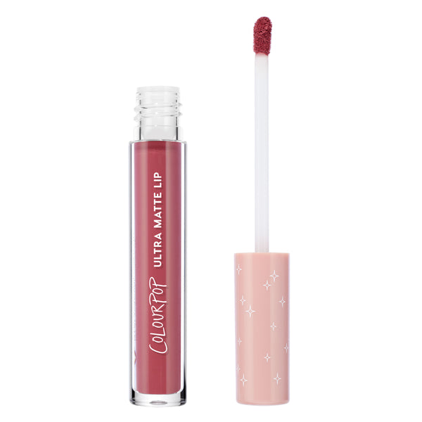 ColourPop Flurries Ultra Matte Lip liquid lipstick stands open with a doe-foot applicator coated in dusty rose mauve, beside a clear tube with white ColourPop branding and a blush pink cap with white star print on a white background.