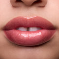 Close-up swatches of Colourpop Fresh Kiss Glossy Balm in Chocolate Cherry on lip tones, showing sheer berry shine with subtle shimmer, promoting Lip Gloss & Lip Oil finish and smooth, hydrated lips.