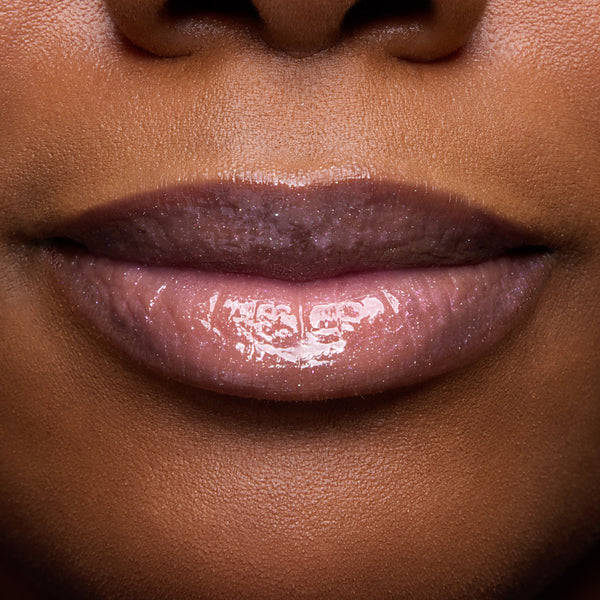 Close-up of models’ lips wearing Colourpop Fresh Kiss Glossy Balm in Raspberry Crème, showing sheer pink shimmer Lip Gloss & Lip Oil finish on different skin tones against a simple studio background.