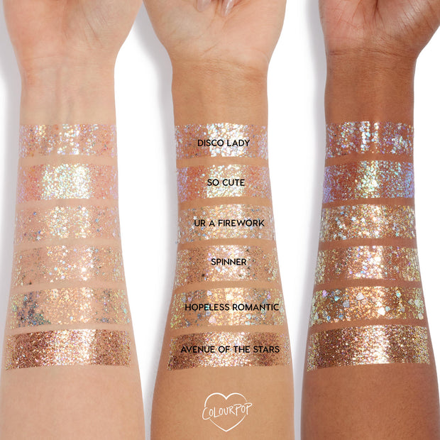ColourPop Glitter Gel in Disco Lady swatched in wide bands across three skin tones, showing dense silver holographic sparkle; labeled rows compare Disco Lady with So Cute, UR A Firework, Spinner, Hopeless Romantic, and Avenue of the Stars.