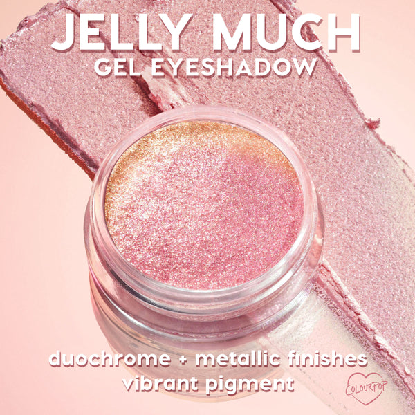 Super Cool ColourPop Jelly Much Shadow gel eyeshadow jar shimmering pink-to-gold duochrome as it catches light, with broad swatches across a blush backdrop highlighting metallic finish and vibrant pigment for bold, long-wear eye looks.