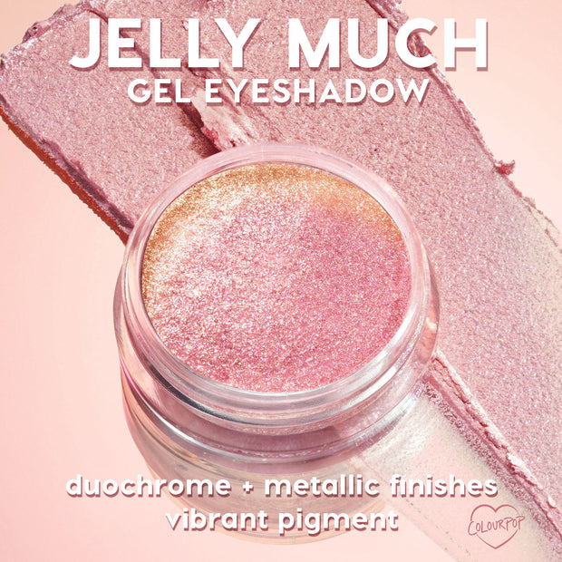 Super Cool ColourPop Jelly Much Shadow gel eyeshadow jar shimmering pink-to-gold duochrome as it catches light, with broad swatches across a blush backdrop highlighting metallic finish and vibrant pigment for bold, long-wear eye looks.