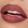 ColourPop Lippie Pencil Double Tap lining softly parted lips, delivering a matte rosy-mauve outline and fill with precise edges; close-up beauty shot on natural skin in studio lighting.