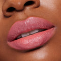 Lips wearing ColourPop Lippie Stix in Felt Cute, a creamy soft pink, reflecting a glossy satin sheen; extreme close-up shows full, even coverage and smooth, hydrated texture for a natural everyday lip look.