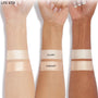 Glazey Lite Stix swatches glow across three forearms, with two stripes per arm - Glazey on top, Sunlight below - showing the ColourPop Lite Stix pearly highlight on light, medium, and deep skin tones against a white background.