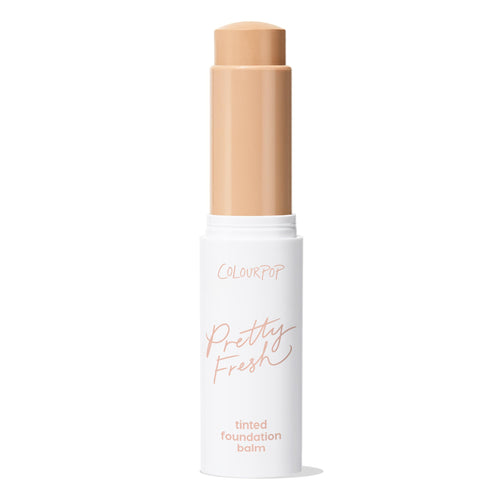 ColourPop Pretty Fresh Tinted Foundation Balm in Light 7 shown open, the beige balm extended from a twist-up stick; sleek white tube with peach Pretty Fresh branding, photographed on a clean white background.