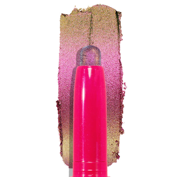 Colourpop Galaxy Shadow Stix eye crayon standing upright, its shimmering duochrome purple-to-gold pigment swatched thickly behind it on a white background for a bold metallic eyeshadow look.