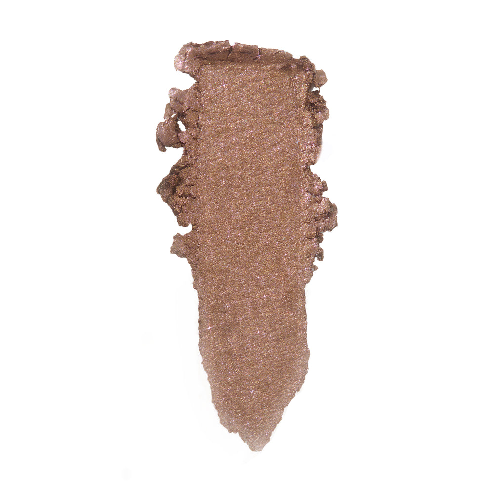 ColourPop So Quiche Super Shock Shadow swatch - metallic taupe with fine pink-lilac sparkle - smeared in a vertical swipe on a clean white background, showing creamy texture and high-shine payoff.