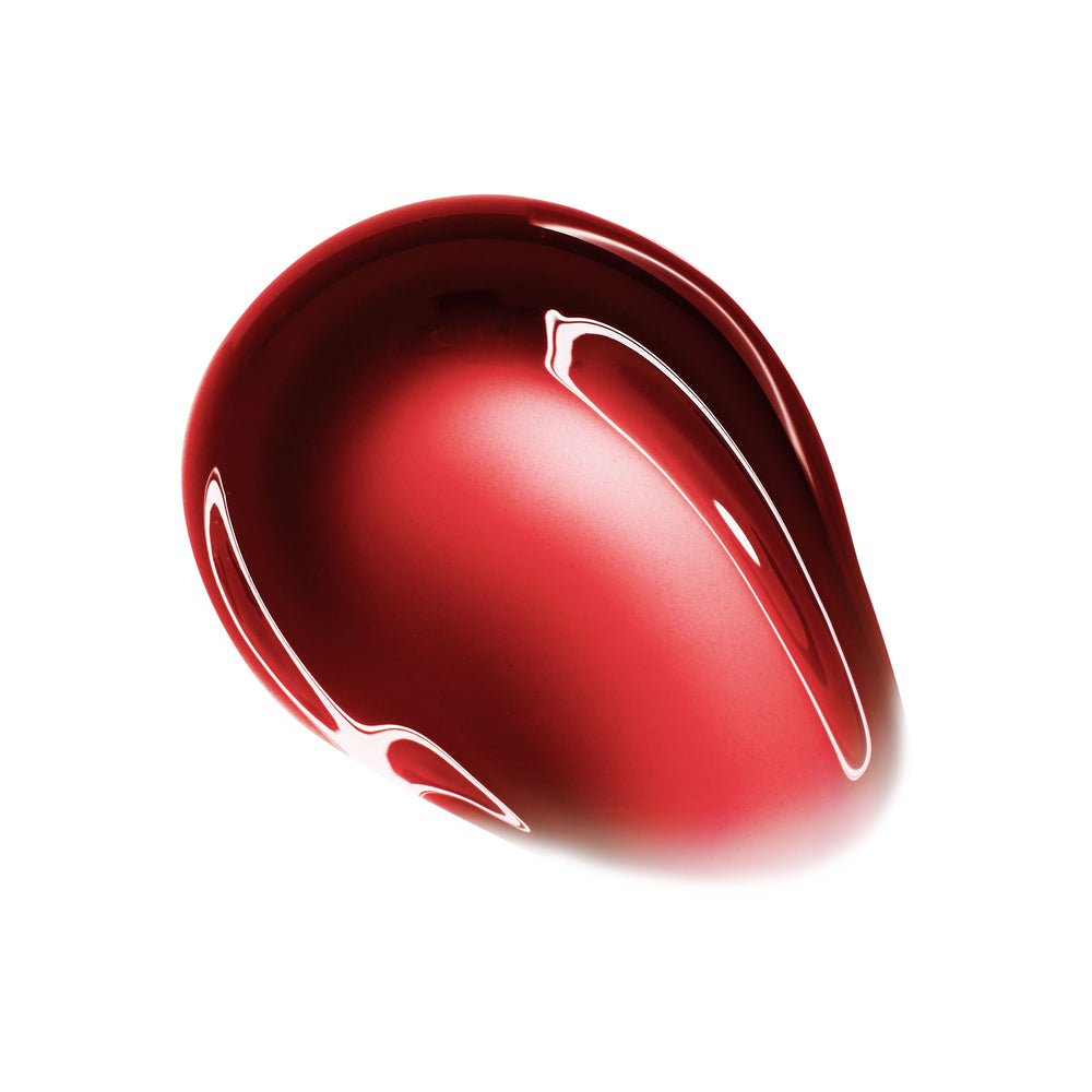 Beverly Drive swatch showing a domed droplet of sheer cherry-red, high-shine gloss with reflective highlights, pooling on a white background - ColourPop So Juicy Plumping Glossy Lip Oil product shot.