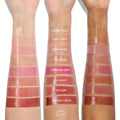 ColourPop So Juicy Plumping Glossy Lip Oil swatches across three arms (light to deep), with shade names labeled; focus on Hits Diff - a warm rosy gloss - positioned between So Sassy and Beverly Drive for easy shade comparison on varied skin tones.