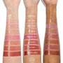 Baby Panda swatch - ColourPop So Juicy Plumping Glossy Lip Oil - gleams as a sheer pink strip, third from top, across three arms in light, medium, and deep tones, shown with other shade swatches to compare high-shine plumping finish.