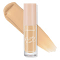 ColourPop Pretty Fresh Creamy Concealer in Medium 90 W stands upright, revealing its hydrating hyaluronic formula; clear tube with blush-pink cap set against two wide warm medium beige swatches on a white background.