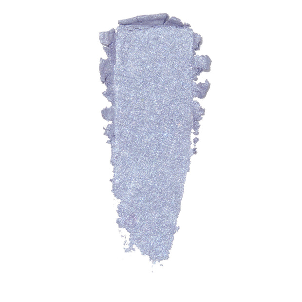 Thick vertical smear of icy lilac eyeshadow with blue-silver shimmer and ragged edges on white, showcasing the finish of ColourPop Moon Daisy Super Shock Shadow.