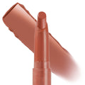 At Twilight ColourPop Lippie Stix shown uncapped and upright, a warm terracotta nude bullet with a creamy satin finish, set against a bold swipe swatch on a white backdrop, highlighting the slim, precise twist-up design.