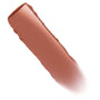 At Twilight ColourPop Lippie Stix swatch sweeping diagonally, creamy warm rosy-brown pigment with a slight sheen on a clean white background, highlighting smooth texture and color payoff.
