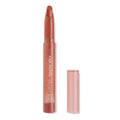 ColourPop Lippie Stix in At Twilight stands uncapped, revealing a slanted warm terracotta lipstick bullet, with a translucent peach tube and the matching cap set beside it on a clean white background.