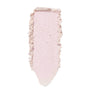 ColourPop Monster Super Shock Highlighter swatched in a single vertical swipe, revealing a pale pink, pearly shimmer with soft, crushed edges and a creamy powder texture on a white background.
