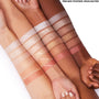 Boombox pressed powder highlighter swatched on three arms, the mid-row strip showing a peachy-gold glow between Easy Livin’ and Summer Camp, demonstrating luminous payoff on light, medium, and deep skin tones; ColourPop Pressed Powder Highlighter.