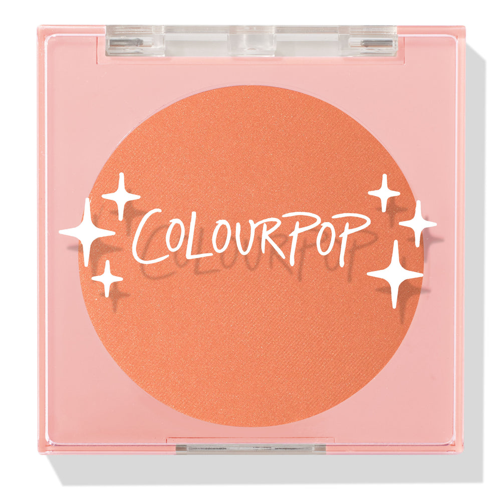 ColourPop Pressed Powder Blush Pretty Toasty compact displaying a warm toasted peach pan, closed under a clear lid with white sparkles logo, set in a pale pink square case for travel-friendly, everyday makeup.