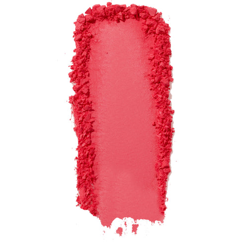 ColourPop Pressed Powder Blush Woo Me swatch - vibrant coral pink pigment swept in a thick vertical streak with a smooth center and crumbled edges, showing buildable payoff and texture on a clean white background.