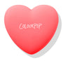 Heart-shaped coral compact shows the ColourPop logo, Woo Me pressed powder blush closed and ready to open, set on a white background with soft shadow; ColourPop Pressed Powder Blush in pink-red case.